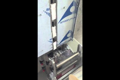 Compact chocolate bar packaging machine with horizontal wrapping and form fill seal capabilities.