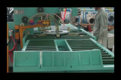 Compact coil handling and wrapping machine.