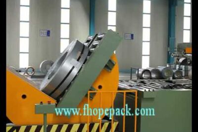 Compact coil upender and packing machine for efficient coil handling.