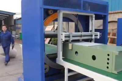 Compact horizontal orbital stretch wrapper for large products and machines.