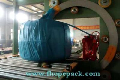 Compact horizontal packing machine for wire coil and pipe packaging.