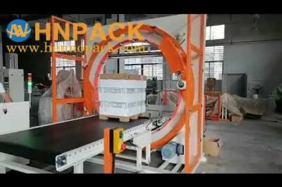 Compact horizontal ring stretch wrapper for warehouse pallet packing.
