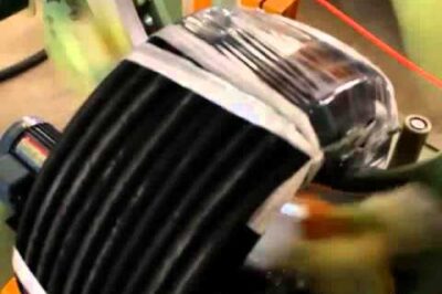 Compact hose and pipe coil wrapping machine for efficient packaging.