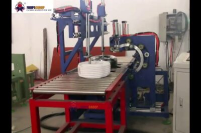 Compact hose packaging machine for efficient automation.
