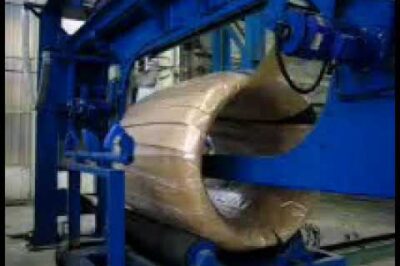 Compact machine for packaging and wrapping steel wire rod coils.