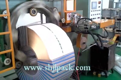 Compact machine for packing coils and wrapping steel materials.