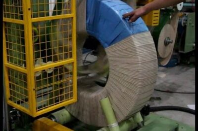 Compact machine for packing toroidal coils and wrapping them tightly.