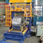 compact steel coil packing machine with trolley design.