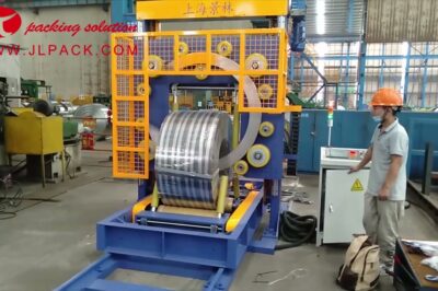 Compact steel coil packing machine with trolley design.