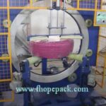 compact stretch wrap machine for pipe coils.