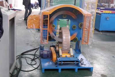 Dual-layer coil wrapping machine in under 12 words.
