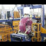 Flexible garden pipe wrapping machine for PVC and HDPE coils.