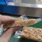 horizontal wrapping machine with flow packaging capabilities, under 12 words.