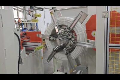 Hose coiling and strapping machine for automobiles in under 12 words.