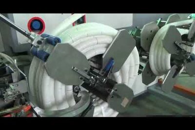 Hose winding and strapping machine for corrugated pipes