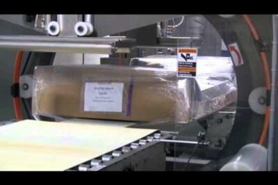 Hospital beds being stretch wrapped with ARPAC’s orbital horizontal stretch wrapper.
