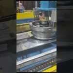 machine for coiling and packing steel wire in a compact