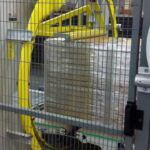 orbital machine wraps pallets with customized strapping