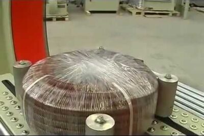 Packaging machine for hoses or coils, compact and efficient.