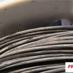 Polyester strap for bundling wire coils.