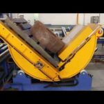 reel tilter and coil upender with conveyor automation