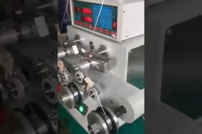 Steel wire winding machine for packaging coils.
