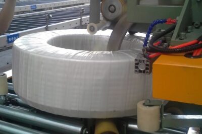 Stretch wrap HDPE pipe coiling machine for efficient packaging.