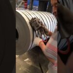 using pneumatic tool and pet strap to pack steel coil