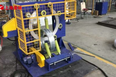 Vertical steel wire wrapping machine for automatic packaging of steel coils.