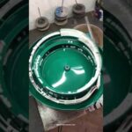 Vibrating bowl for sorting plastic terminal parts in wire packaging.