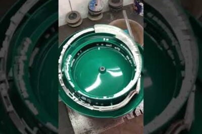Vibrating bowl for sorting plastic terminal parts in wire packaging.