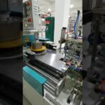 wire and cable coiling, labeling, and film packing machine with
